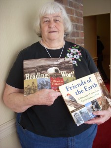 Author Pat McCarthy holding her books.