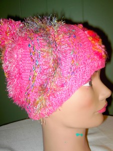 Free caps made by Stitches of Hope volunteers and given to people with cancer.