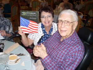Richard Vanderwall being presented with his copy of my book which includes his WWII story.